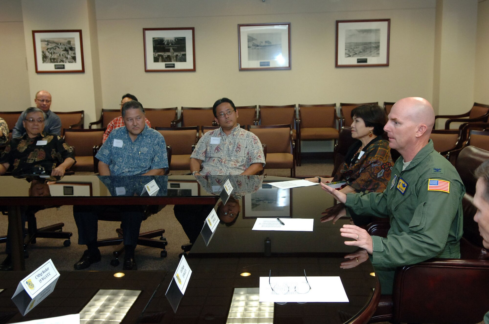 Colonel Sam Barrett, 15th Wing commander, meets with members of the Friends of Hickam community group Mar. 10 at Joint Base Pearl Harbor-Hickam, Hawaii during an orientation tour and social. The Friends of Hickam are local community representatives who serve as facilitators between the 15th Wing and the Hawaiian community and seek to support, promote and foster strong community relations with 15th Wing leaders. (Photo by David D. Underwood, Jr.)