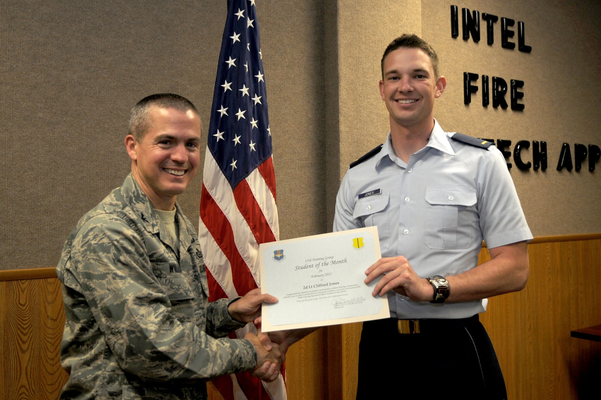 GOODFELLOW AIR FORCE BASE, Texas – Second Lt. Clifford Jones, 315th Training Squadron student, receives his February Student of the Month certificate from Col. J.D. Willis, 17th Training Group Commander. The 315th TRS has both Enlisted and Officer Student of the Month categories.  (U.S. Air Force photo/Staff Sgt. Heather L. Rodgers)