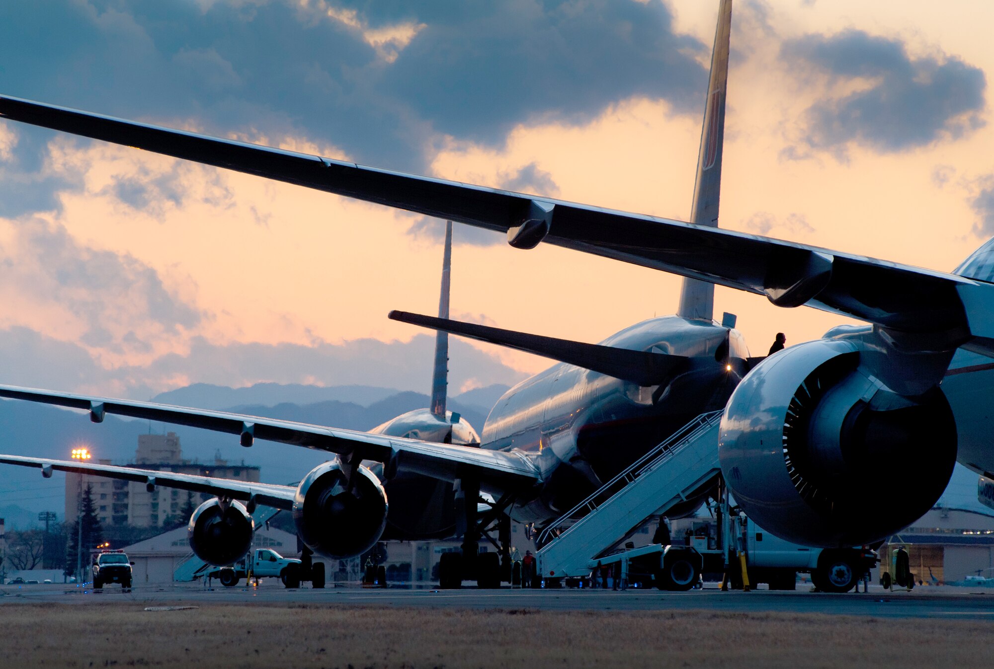 Aircraft are parked at Yokota Air Base, Japan, after diverting from Narita International Airport in Tokyo. Officials opened Yokota AB?s airfield March 11, 2011, after an earthquake struck Tokyo. (U.S. Air Force photo/Staff Sgt. Samuel Morse)