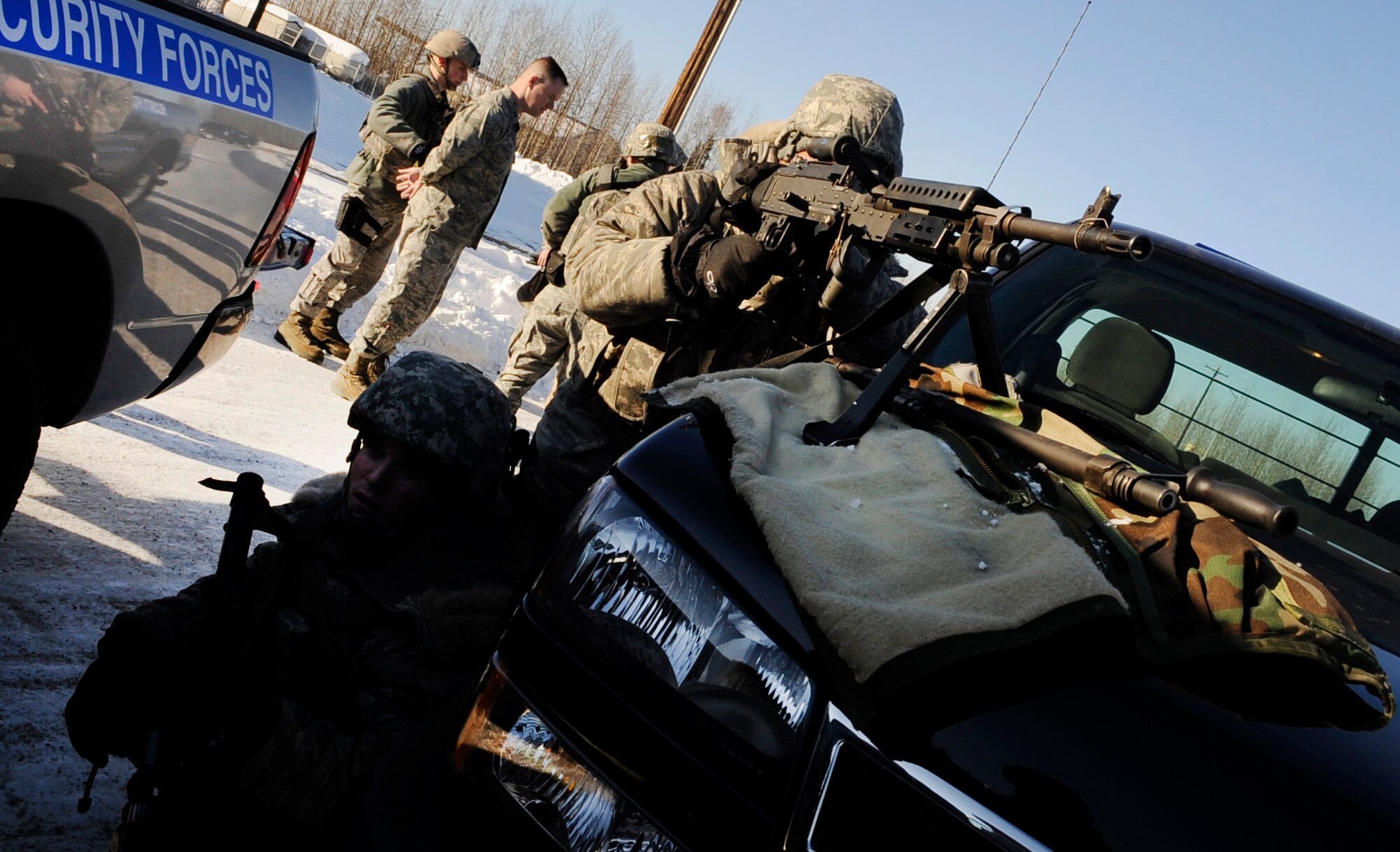 Security Forces Airmen cordon the perimeter of a simulated hostile situation inside a 354th Maintenance Squadron building during an operational readiness exercise March 9, 2011 Eielson Air Force Base, Alaska. The exercise is designed to give Airmen experience training in a simulated heightened threat environment. (U.S. Air Force photo/Airman 1st Class Laura Goodgame)