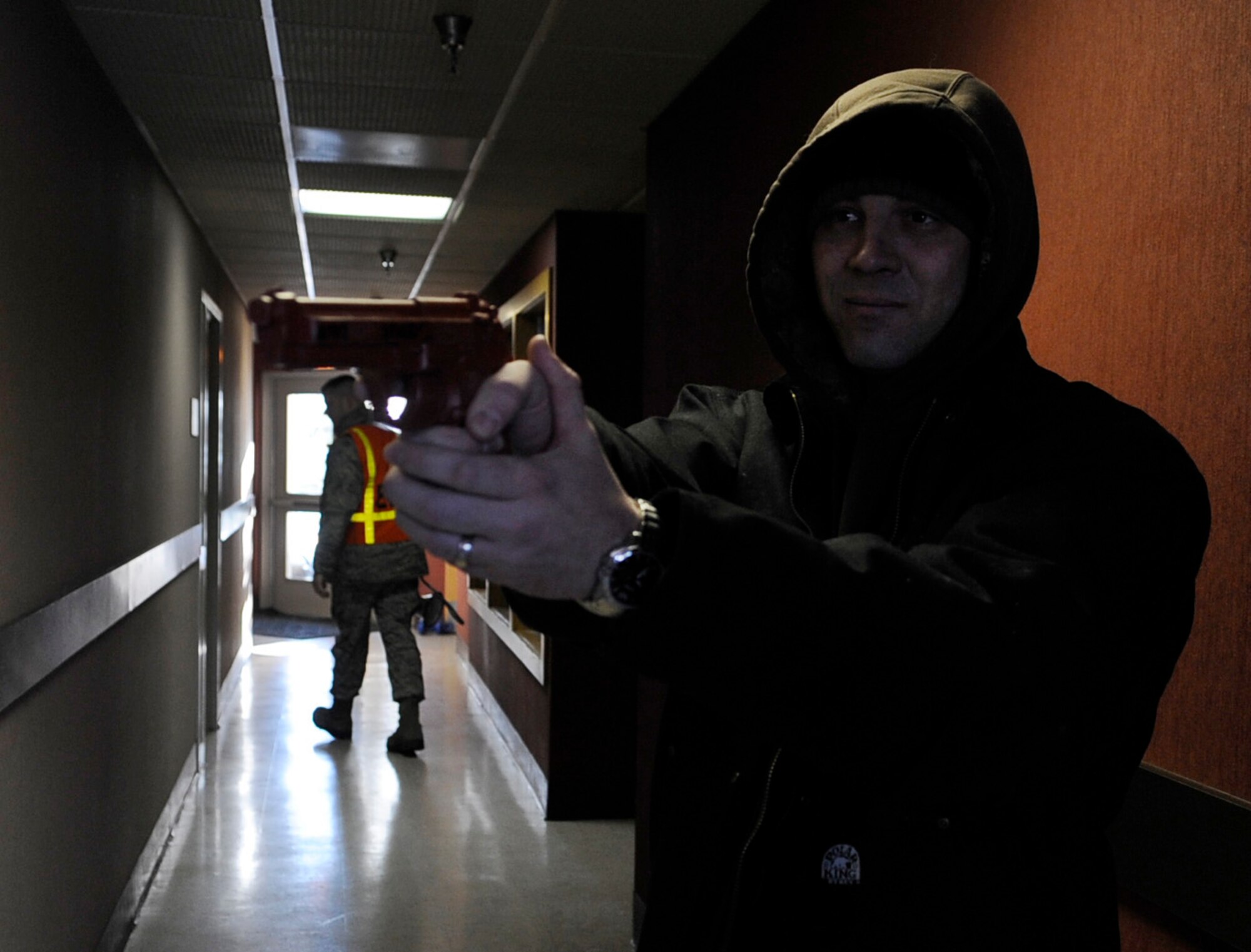 Tech. Sgt. Chris Lauder simulates his role as an active shooter during an operational readiness exercise March 9, 2011 Eielson Air Force Base, Alaska. The exercise is designed to give Airmen experience training in a simulated heightened threat environment while accomplishing the mission. Sergeant Lauder is petroleum, oils, lubricants technician assigned to 354th Logistics Readiness Squadron. (U.S. Air Force photo/Airman 1st Class Laura Goodgame)