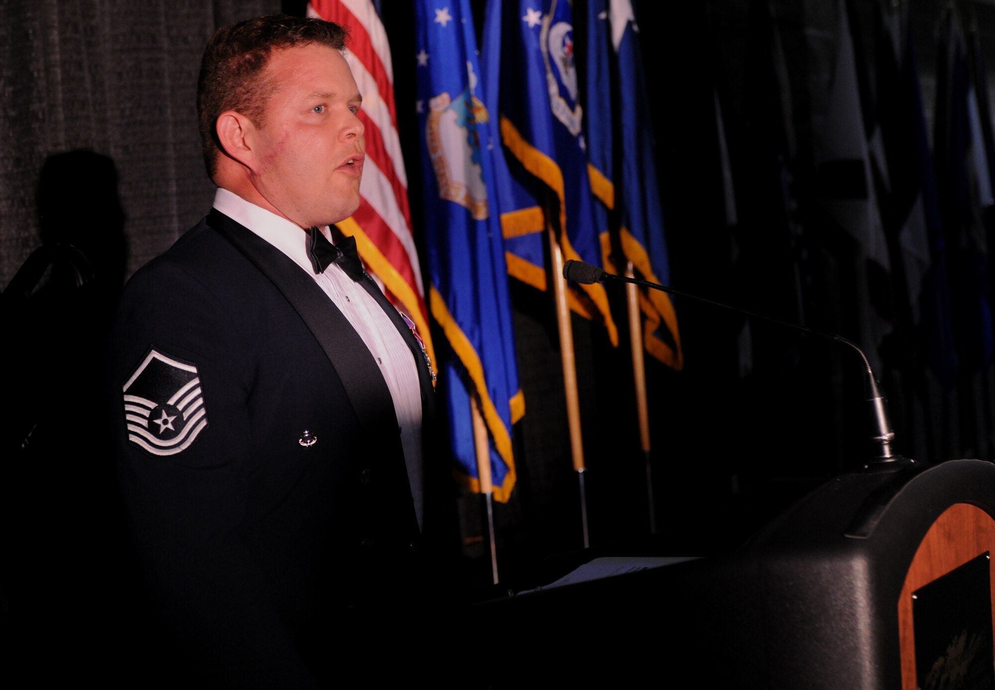 VALDOSTA, Ga.-- Master Sgt. Robert Disney, 347th Rescue Group standards and evaluations superintendent, sings the national anthem during the Outstanding Performers of the Year awards ceremony at the James H. Rainwater Conference Center in Valdosta, Ga., March 10. Nominees and wing representatives came to the conference center to attend the social hour followed by the awards ceremony. (U.S. Air Force photo/Airman 1st Class Benjamin Wiseman)(RELEASED)
