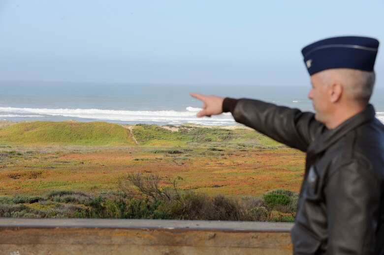 VANDENBERG AIR FORCE BASE, Calif. – Pointing to wave activity further down Wall Beach, Col. Richard Boltz, 30th Space Wing commander, observes dangers associated with the tsunami warnings in order to make safety decisions for the base Friday, March 11, 2011.   (U.S. Air Force photo/Senior Airman Lael Huss)