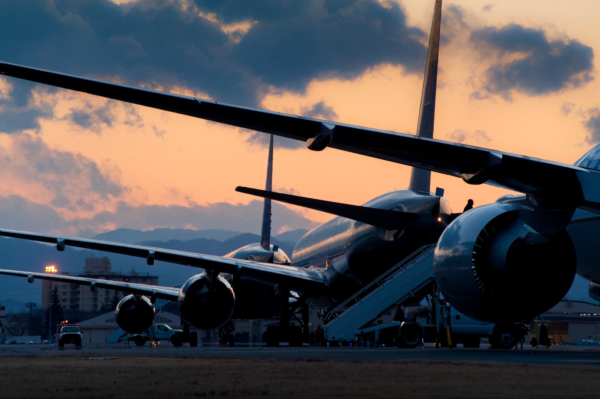 YOKOTA AIR BASE, Japan -- Commercial aircraft sit on the flightline here March 11, after diverting from Narita International Airport, Tokyo, Japan. The base opened its airfield to commercial aircraft after an earthquake struck near Tokyo. (U.S. Air Force photo/Staff Sgt. Samuel Morse)