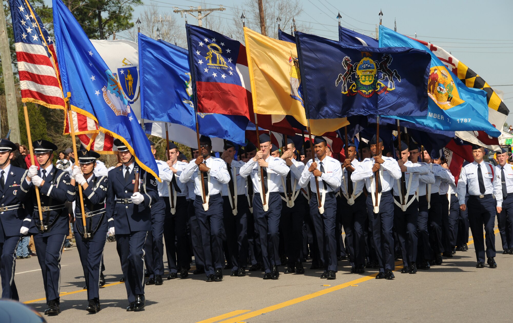 The Keesler Honor Guard and the 50 state flag team lead the North Bay Carnival Association Mardi Gras parade in D'Iberville March 6.  (U.S. Air Force photo by Kemberly Groue)