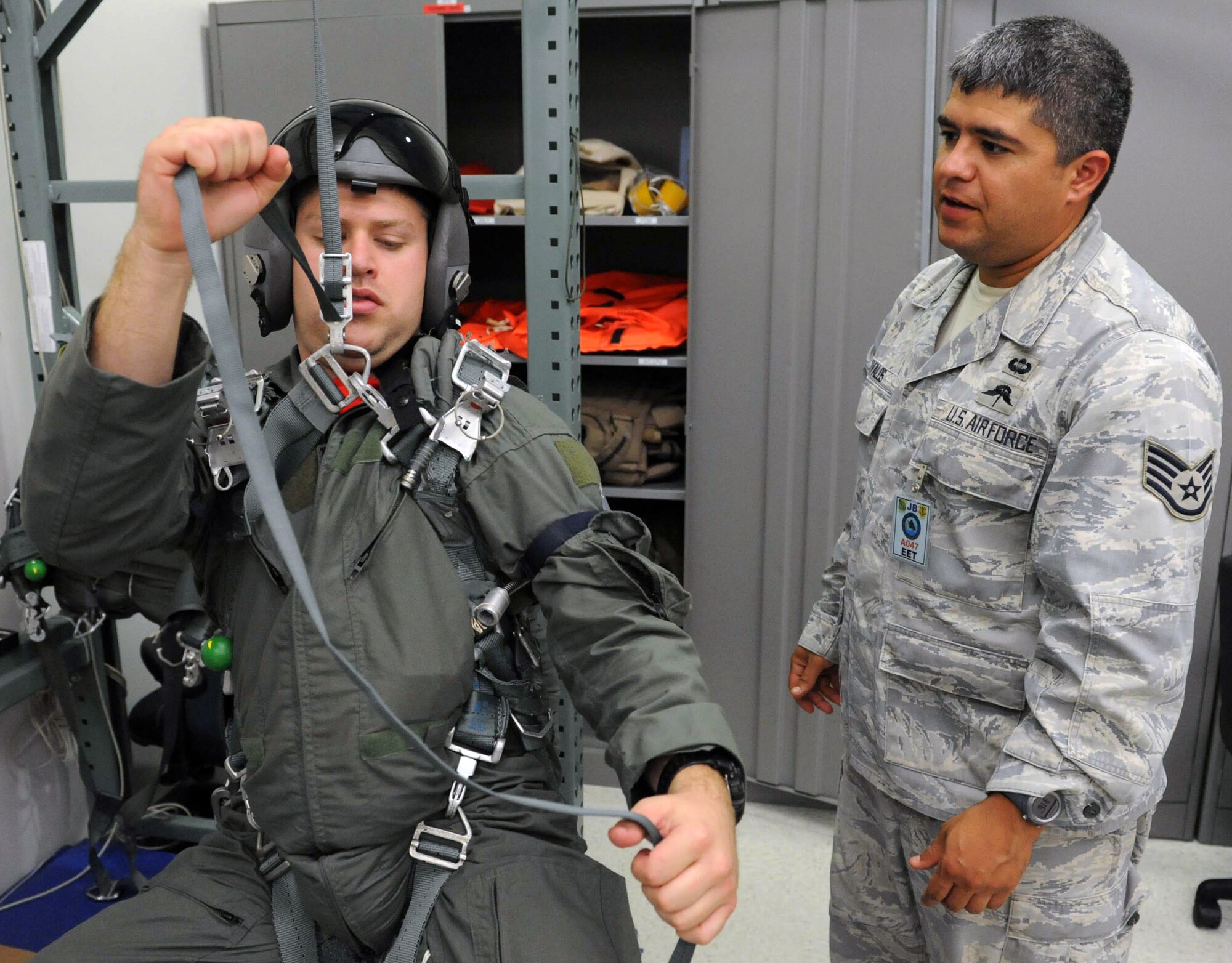 Staff Sgt. Robert Wyman, 535th Airlift Squadron loadmaster, is tested on parachute deployment procedures during an Operational Readiness Exercise Mar. 4 at Joint Base Pearl Harbor Hickam. The ORE tested Airmen's ability to respond to survive and operate during various wartime conditions. (U.S. Air Force photo/Staff Sgt. Nathan Allen)