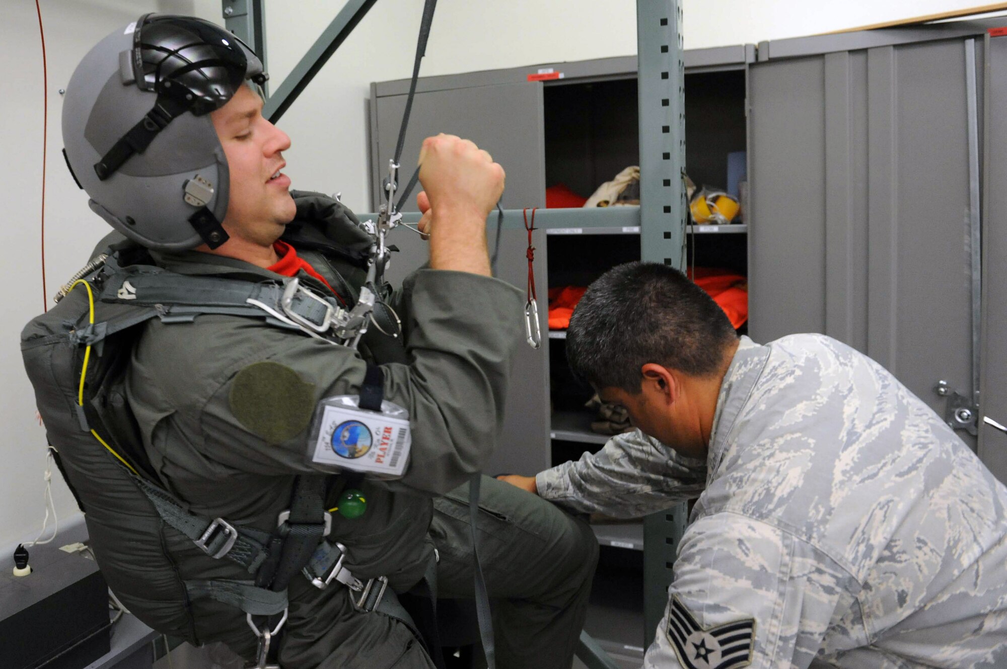 Staff Sgt. Robert Wyman, 535th Airlift Squadron loadmaster, is tested on parachute deployment procedures during an Operational Readiness Exercise Mar. 4 at Joint Base Pearl Harbor Hickam. The ORE tested Airmen's ability to respond to survive and operate during various wartime conditions. (U.S. Air Force photo/Staff Sgt. Nathan Allen)