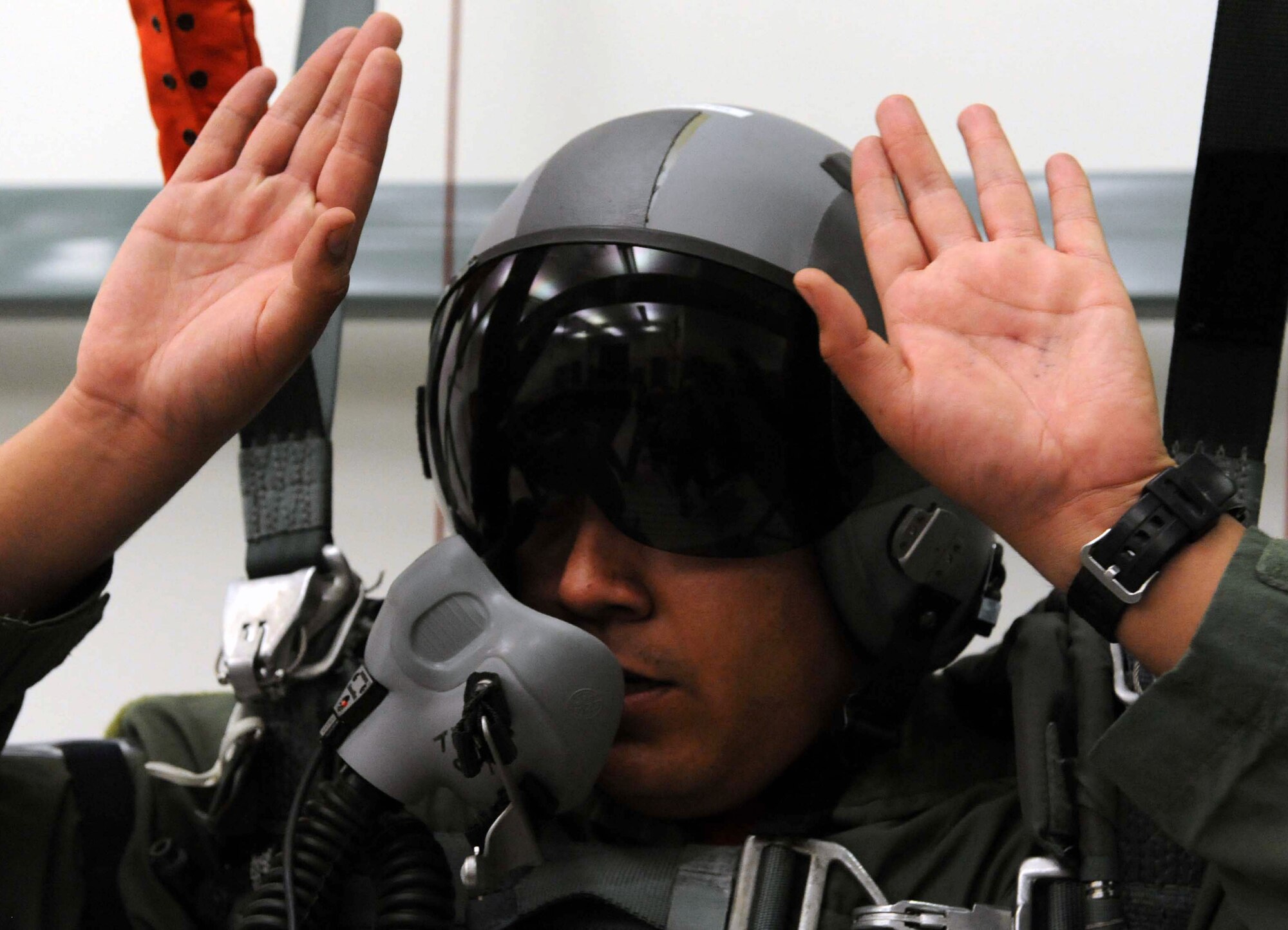Capt. Gabriel Chavarra, 535th Airlift Squadron pilot, is tested on parachute deployment procedures during an Operational Readiness Exercise Mar. 4 at Joint Base Pearl Harbor Hickam. The ORE tested Airmen's ability to respond to survive and operate during various wartime conditions. (U.S. Air Force photo/Staff Sgt. Nathan Allen)