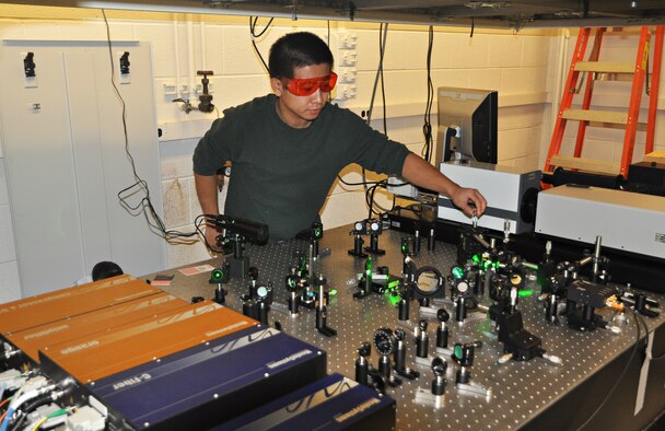 Graduate student Huarui Sun performs sensitive measurement of
interfacial thermal transport using an ultrafast laser system. (Credit:
Abhishek Yadav)
