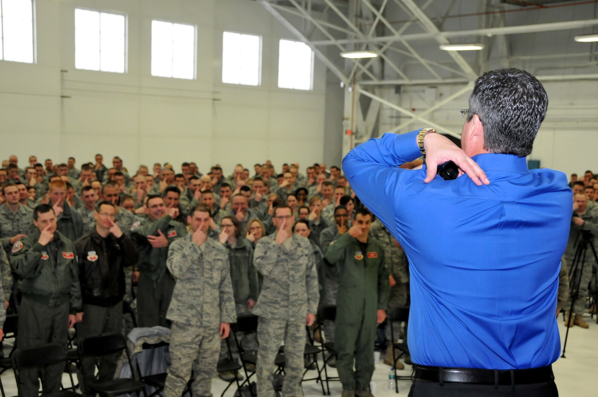 Curtis Zimmerman, guest speaker, leads members of the 115th Fighter Wing, Madison, Wis., in a game of Simon Says, during Wingman day, Mar. 6, 2011.  Wingman day promoted "living the dream," and taking care of your fellow airman.  (U.S. Air Force photo by Tech. Sgt. Ashley Bell)