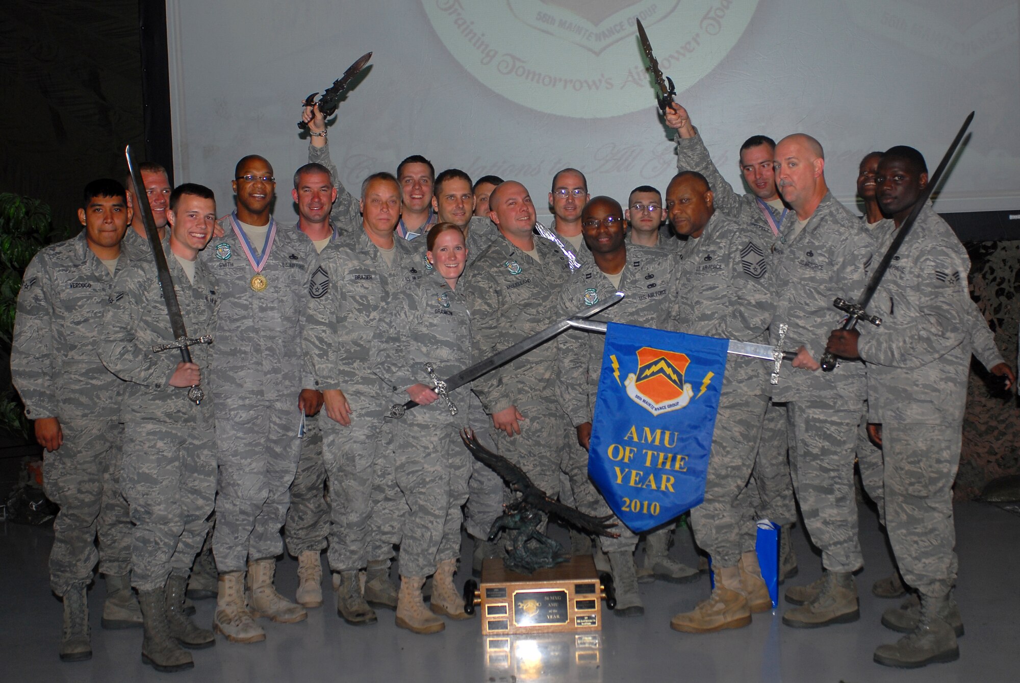 Members of the 308th Aircraft Maintenance Unit pose for a photograph after winning the 56th Maintenance Group AMU of the Year during the maintenance professional of the year banquet.  (U.S. Air Force photo/Senior Airman Tracie Forte)