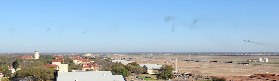 The smoke trails of six B-52H Stratofortress’ can be seen fading into the distance over Barksdale Air Force Base, La., as a seventh aircraft takes-off March 10. Aircrafts from the 2nd Bomb Wing’s 20th and 96th Bomb Squadrons participated in the training event formerly known as a Minimal Interval Take-Off, now called a Large Force Departure. Each B-52 launched approximately 30 seconds after it’s predecessor showing the crews how to handle turbulence in the wake of other aircraft. (U.S. Air Force photo/Senior Airman Joanna M. Kresge)