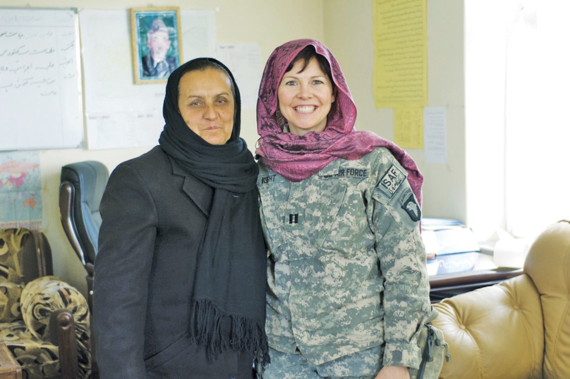 Capt. Ann Voght, 56th Medical Operations Squadron, meets with Ms. Kohistani, Provincial Department of Women's Affairs director, in the provincial capital, Mahmud-E Raqi.  (U.S. Air Force photo/Staff Sgt. Kyle Brasier)