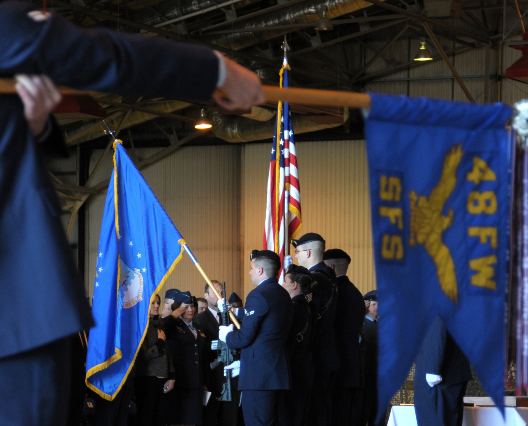 ROYAL AIR FORCE LAKENHEATH, England - A color guard, comprised of Airmen from the 48th Security Forces Squadron, post the colors during a memorial service for Senior Airman Nicholas J. Alden, a security forces journeyman, in Hangar 7 on March 11, 2011. Airman Alden was killed in action during a shooting incident at Frankfurt International Airport, Germany, March 2, 2011.  More than 500 Airmen, family and friends were in attendance. (U.S. Air Force photo/Airman Cory Payne)
