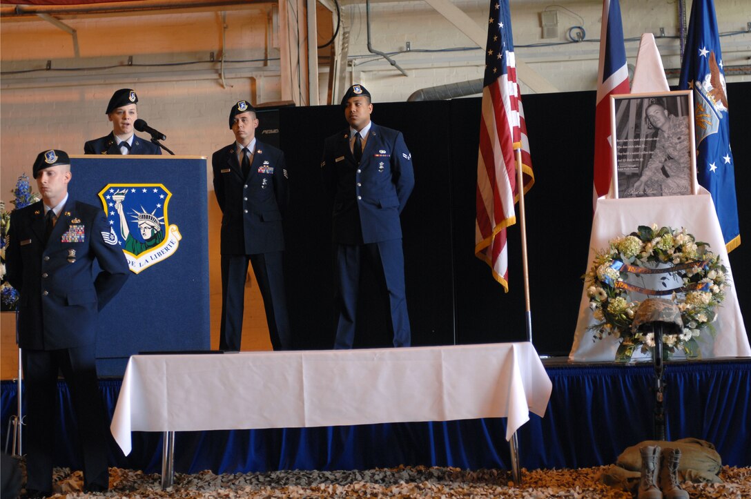 ROYAL AIR FORCE LAKENHEATH, England - Senior Airman Ashley Kaid, 48th Security Forces Squadron desk sergeant, gives remarks during a memorial service in Hangar 7 on March 11, 2011.  The 48th Fighter Wing held a memorial service in honor of Senior Airman Nicholas J. Alden, a security forces journeyman killed in action during a shooting incident at Frankfurt International Airport, Germany, March 2, 2011.  More than 500 Airmen, family and friends were in attendance. (U.S. Air Force photo/Tech. Sgt. Lee A. Osberry Jr.)