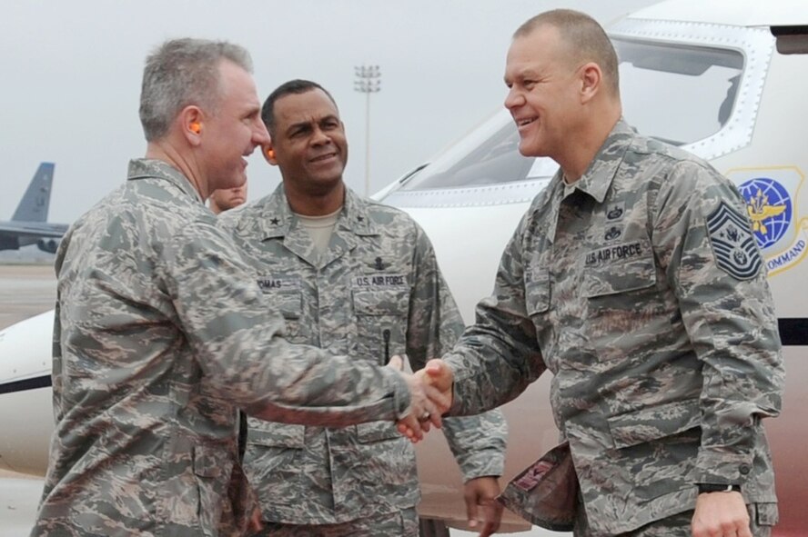 Col. Tim Fay, 2nd Bomb Wing commander, with Brig. Gen. Everett Thomas, Air Force Global Strike Command, vice commander, greets Chief Master Sgt. of the Air Force James A. Roy upon his arrival to Barksdale Air Force Base, La.,
March 8. (U.S. Air Force photo/Senior Airman Alexandra M. Boutte)