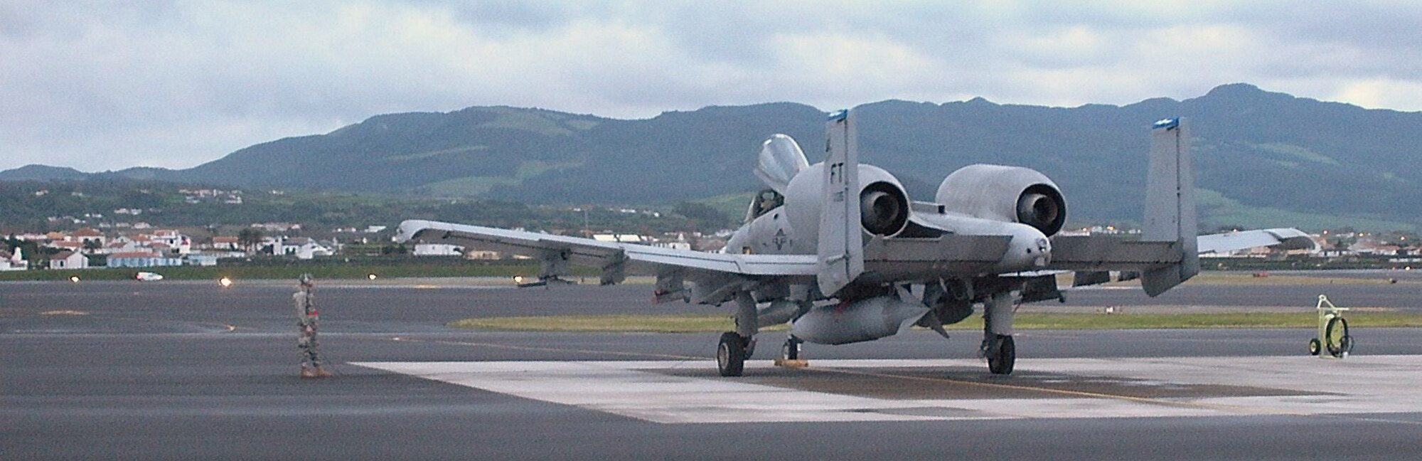 LAJES FIELD, AZORES-- A maintainer from the 23rd Maintenance Group at Moody Air Force Base, Ga., stands near an A-10C Thunderbolt II. The 23rd MXG recently sent members from three squadrons here to help get the Warthogs en route to a deployed location combat-ready. (U.S. Air Force photo/Contributed)(RELEASED)   