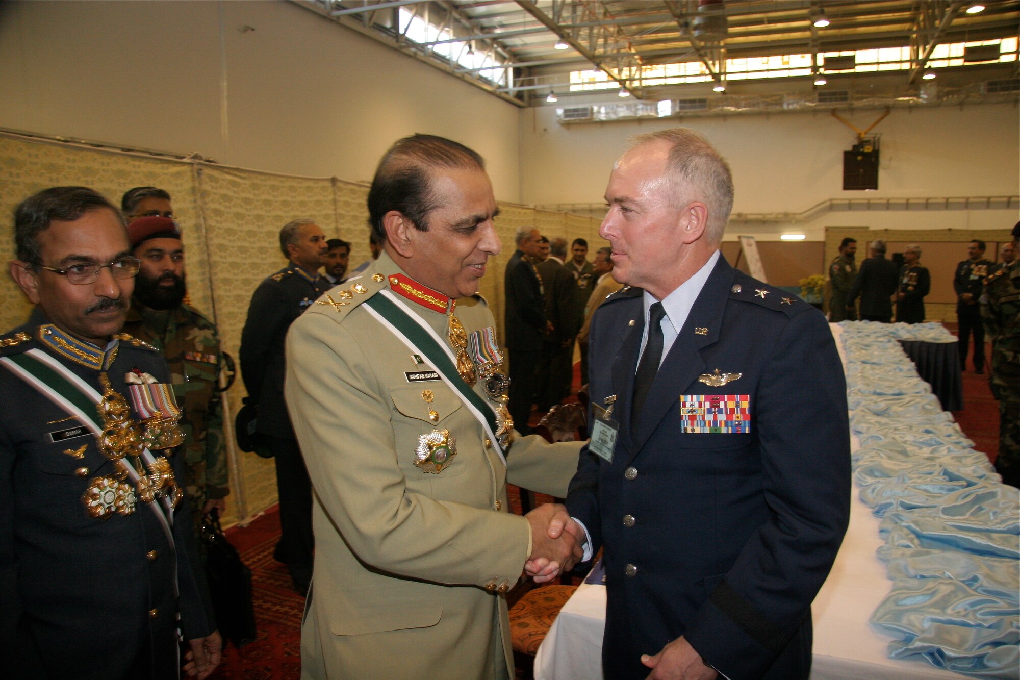 Major General Richard Shook, the Individual Mobilization Augmentee to the Commander of U.S. Air Forces Central Command meets General Ashfaq Parvez Kayani, Chief of the Army Staff.  Both were present on March 10 at Pakistan Air Force Base Shahbaz, in Jacobabad, Pakistan for a re-equipping ceremony in which the Pakistan Air Force formally activated the squadron with 18, F-16 Block 52 aircraft procured from the United States. (U.S. Air Force photo by Lt. Col. Michael Shavers)