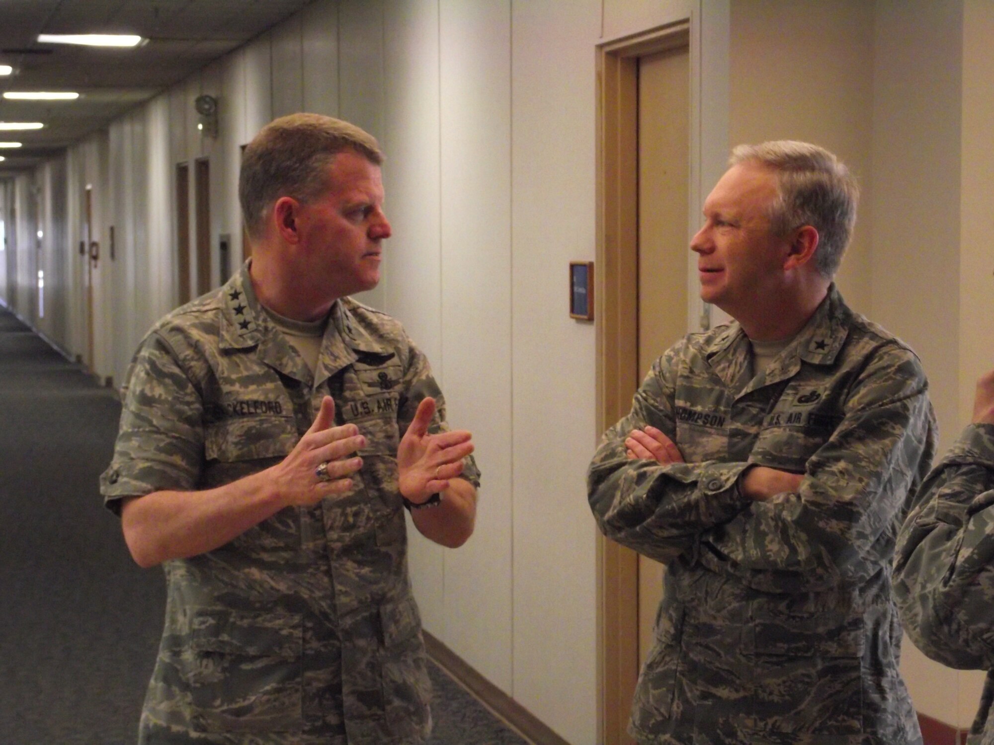 Lt. Gen. Mark Shackelford, Office of the Assistant Secretary for Acquisition, left, speaks to Brig. Gen. John Thompson, Air Force Program Executive Officer for Strategic Systems before the town hall meeting for Kirtland AFB’s acquisition personnel.  U.S. Air Force Photo by Stefan Bocchino