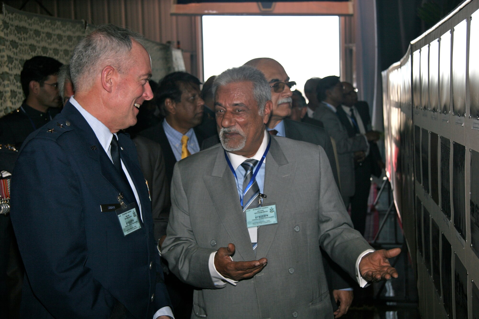 Major General Richard Shook, the Individual Mobilization Augmentee to the Commander of U.S. Air Forces Central Command discusses the history of Pakistan Air Force Squadron 5 with retired Pakistan Air Commodore Safdar Mahmood.  Both were present on March 10 at Pakistan Air Force Base Shahbaz, in Jacobabad, Pakistan for a re-equipping ceremony in which the Pakistan Air Force formally activated the squadron with 18, F-16 Block 52 aircraft procured from the United States. (U.S. Air Force photo by Lt. Col. Michael Shavers)