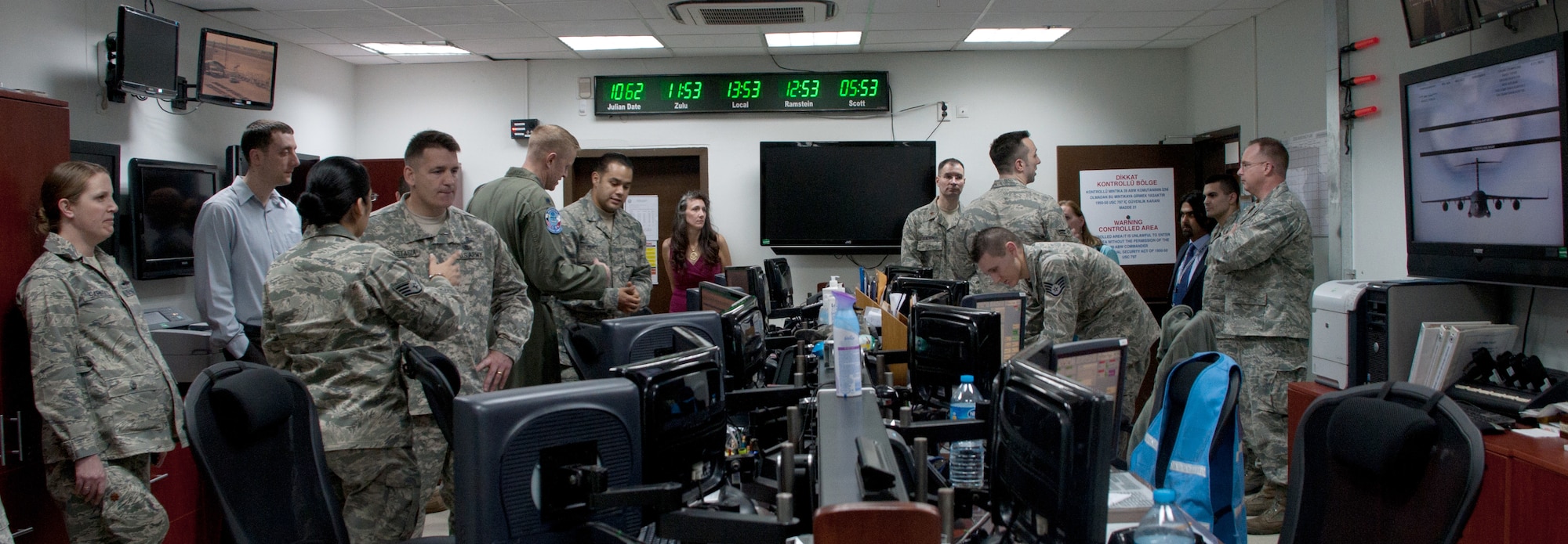 Special guests and visitors look at the newly installed communications system at the 728th Air Mobility Squadron March 3, 2011, at Incirlik Air Base, Turkey. The 728th AMS installed a $400,000 communications system that will save time and manpower to complete the mission more efficiently, officials said. (U.S. Air Force photo by Staff Sgt. Alexandre Montes) 
