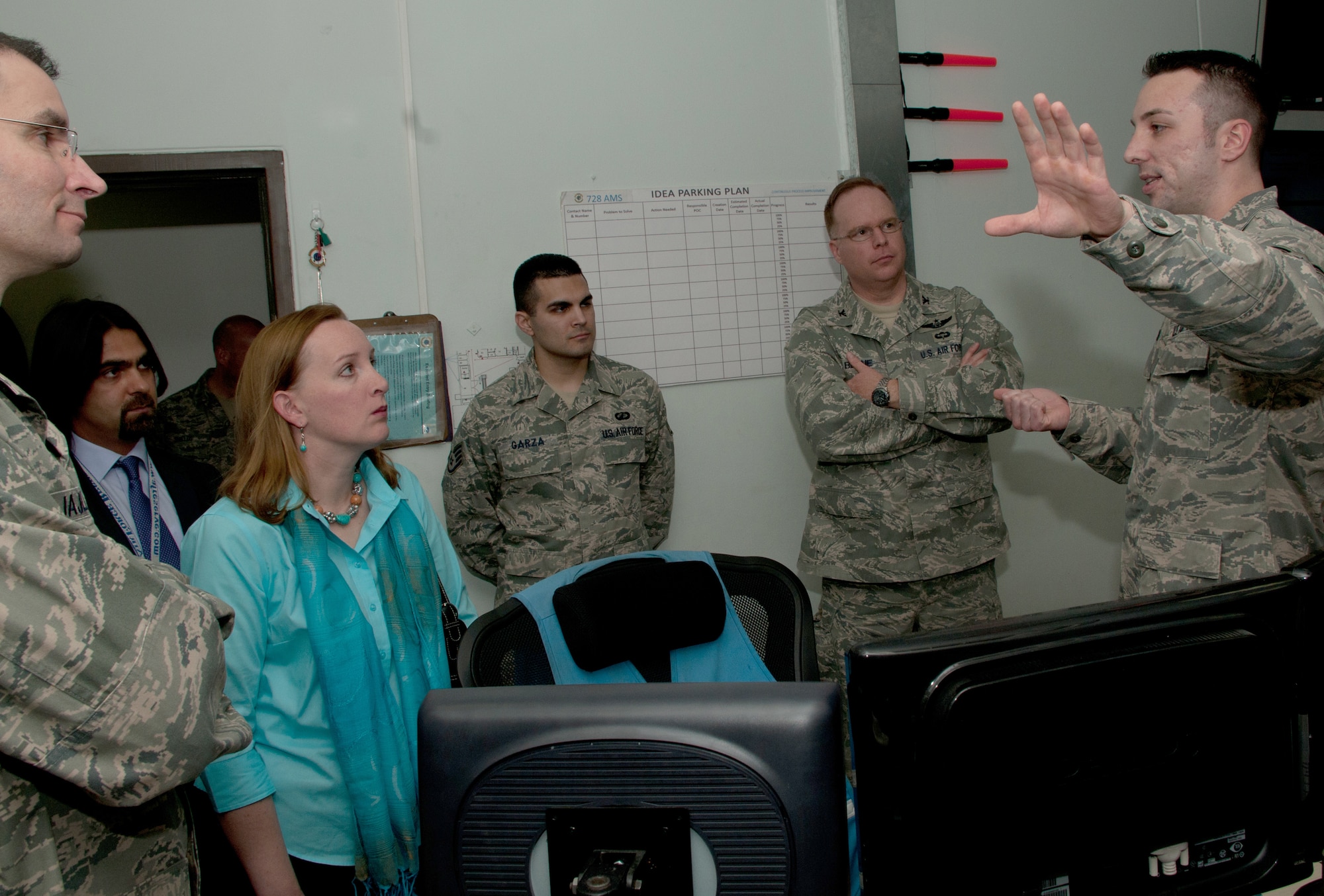 Airman 1st Class Eric Krausen, from the 728th Air Mobility Squadron, briefs visitors after a ribbon cutting ceremony for the newly installed communications system March 3, 2011, at Incirlik Air Base, Turkey. The 728th AMS installed a $400,000 communications system that will save time and manpower to complete the mission more efficiently, officials said. (U.S. Air Force photo by Staff Sgt. Alexandre Montes) 