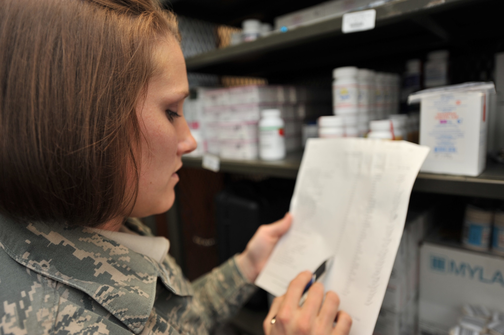 Staff Sgt. Jackie Wolfe, 455th Expeditionary Medical Support Squadron pharmacy tech, does a full inventory of narcotics at Bagram Airfield, Afghanistan, March 3, 2011. Full inventory of narcotics are done twice a day to ensure positive control of controlled substance. Sergeant Wolfe is deployed from Lackland Air Force Base, Texas. (U.S. Air Force photo by Senior Airman Sheila deVera)