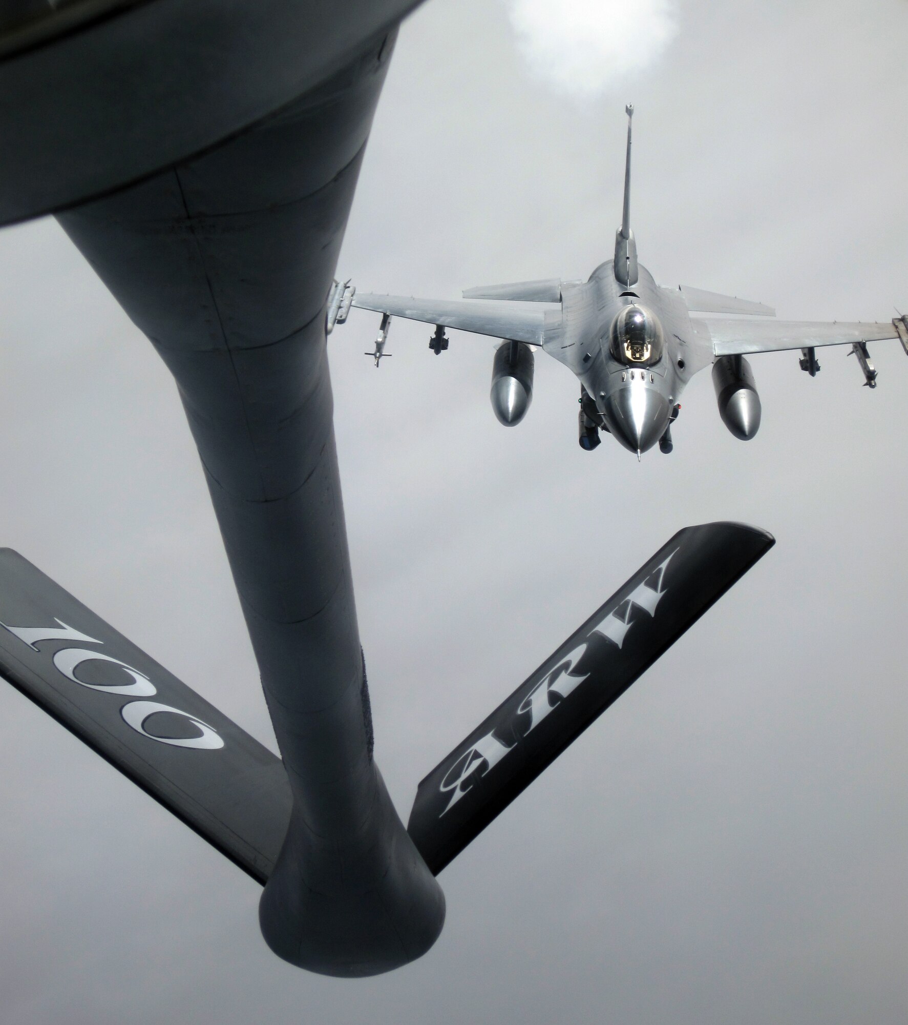 An F-16 Fighting Falcon pilot from Spangdahlem Air Base, Germany, approaches the boom of a 100th Air Refueling Wing KC-135 Stratotanker to receive fuel as both aircraft fly over Germany, March 10, 2011. (U.S. Air Force photo/A1C Rachel Waller)
