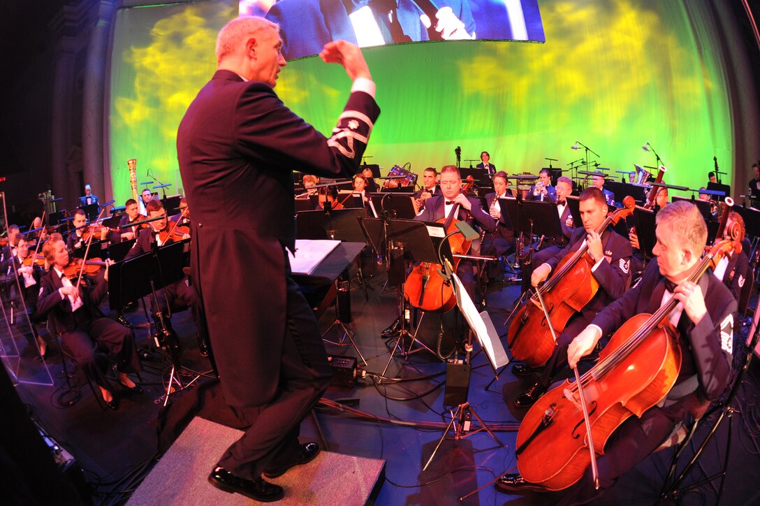 Lt. Col. A. Phillip Waite, commander and conductor of The U.S. Air Force Band, leads the concert band March 6 at the Daughters of the American Revolution Constitution Hall, Washington, D.C. The performance is part of the USAF Band’s 2011 Guest Artist Series. (U.S. Air Force photo by Senior Airman Christopher Ruano)