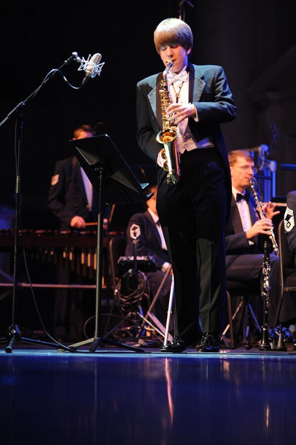 Jordan Lulloff, winner of the Colonel George S. Howard Young Artist Competition, performs March 6 at the Daughters of the American Revolution Constitution Hall, Washington, D.C., with The U.S. Air Force Band. Jordon Lulloff, a senior at Okemos High School, Okemos, Mich., competed with four other finalists from across the nation in a recital Jan. 27 at Joint Base Anacostia-Bolling, Washington, D.C. (U.S. Air Force photo by Senior Airman Christopher Ruano)
