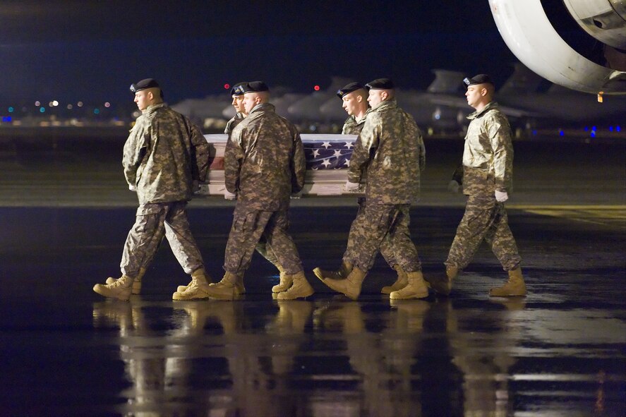 A U.S. Army carry team transfers the remains of Army Cpl. Loren M. Buffalo, of Mountain Pine, Ark., at Dover Air Force Base, Del., March 11, 2011. Buffalo was assigned to the 1st Squadron, 75th Cavalry Regiment, 2nd Brigade Combat Team, 101st Airborne Division (Air Assault), Fort Campbell, Ky. (U.S. Air Force photo/Roland Balik)