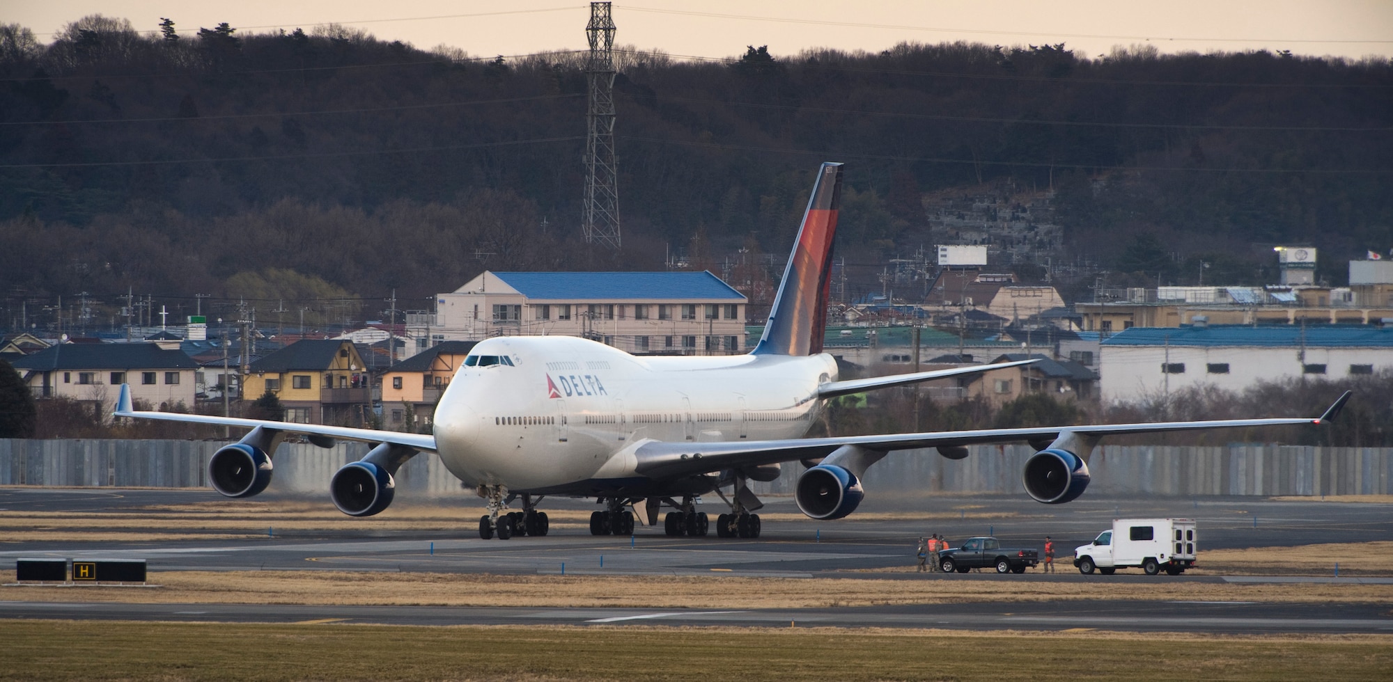 YOKOTA AIR BASE, Japan -- A Delta Airlines flight lands here March 11, after diverting from Narita International Airport, Tokyo, Japan. Yokota opened its airfield after an earthquake struck near Tokyo. (U.S. Air Force photo/Staff Sgt. Samuel Morse)