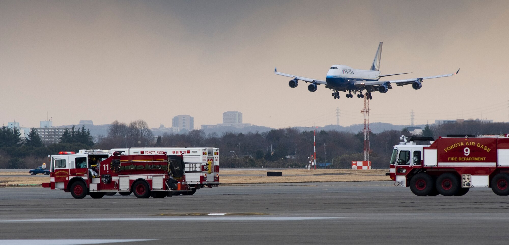 YOKOTA AIR BASE, Japan - A United Airlines flight lands here March 11, after diverting from Narita International Airport, Tokyo, Japan. Yokota opened its airfield after an earthquake struck near Tokyo. (U.S. Air Force photo/Staff Sgt. Samuel Morse)