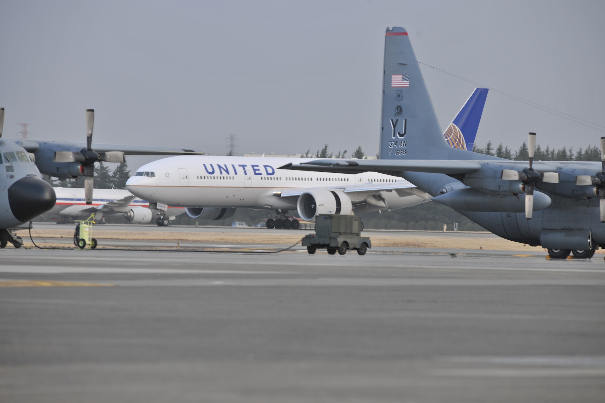 A United Airlines flight lands here March 11, after diverting from Narita International Airport, Tokyo, Japan. Yokota opened its airfield after an earthquake struck near Tokyo. (U.S. Air Force photo/Master Sgt. Kimberly Spinner)