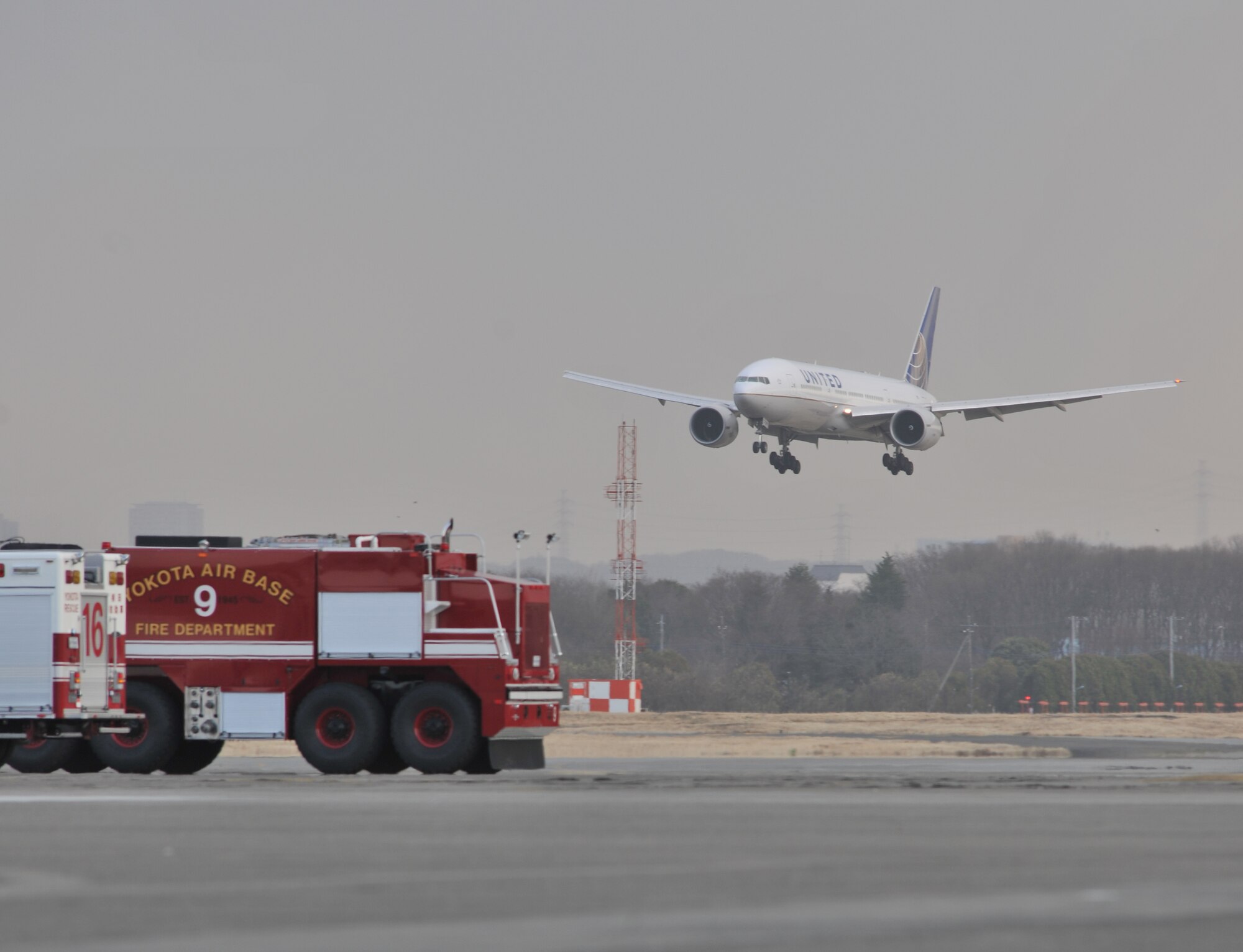 A United Airlines flight lands here March 11, after diverting from Narita International Airport, Tokyo, Japan. Yokota opened its airfield after an earthquake struck near Tokyo. (U.S. Air Force photo/Master Sgt. Kimberly Spinner)