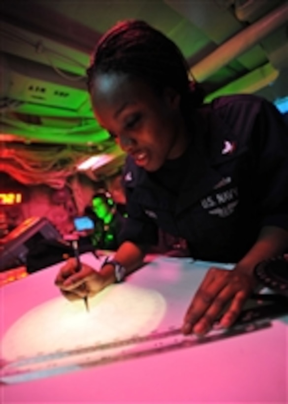 Petty Officer 3rd Class Lakysha Brown uses the dead reckoning tracer to plot the ship's course and speed in the commanding officer's tactical plot room aboard the aircraft carrier USS Enterprise (CVN 65) underway in the Red Sea on March 8, 2011.  The Enterprise and Carrier Air Wing 1 are on routine deployment conducting maritime security operations in the U.S. 5th Fleet area of responsibility.  