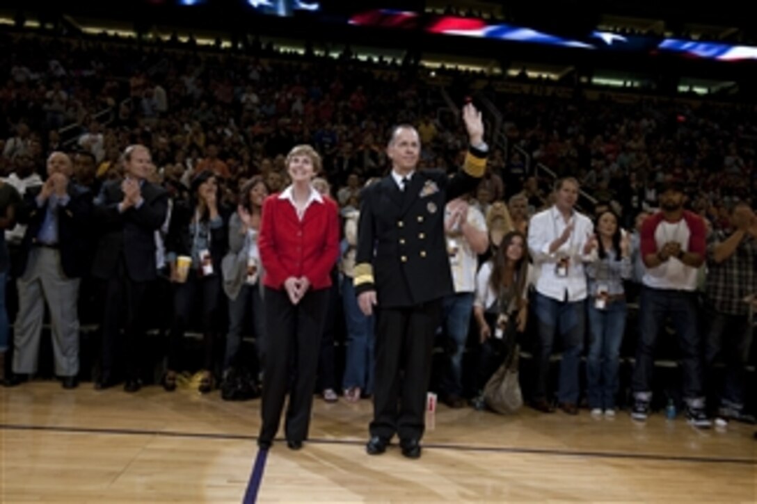 Chairman of the Joint Chiefs of Staff Adm. Mike Mullen and his wife Deborah are honored during a Phoenix Suns timeout at Sun Stadium in Phoenix, Ariz., on March 10, 2010.  Mullen visited Phoenix to speak with Arizona local and state officials in his continuing Conversations with the Country tour.  