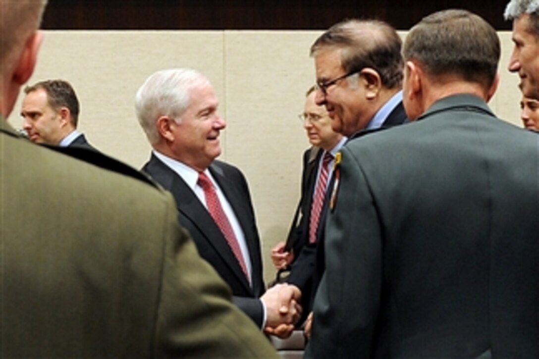 Secretary of Defense Robert M. Gates shakes hands with Defense Minister of Afghanistan Abdul Rahim Wardak (2nd from right) at the NATO headquarters in Brussels, Belgium, on March 11, 2011.  Gates is in Belgium to attend NATO Defense Ministers meetings.  