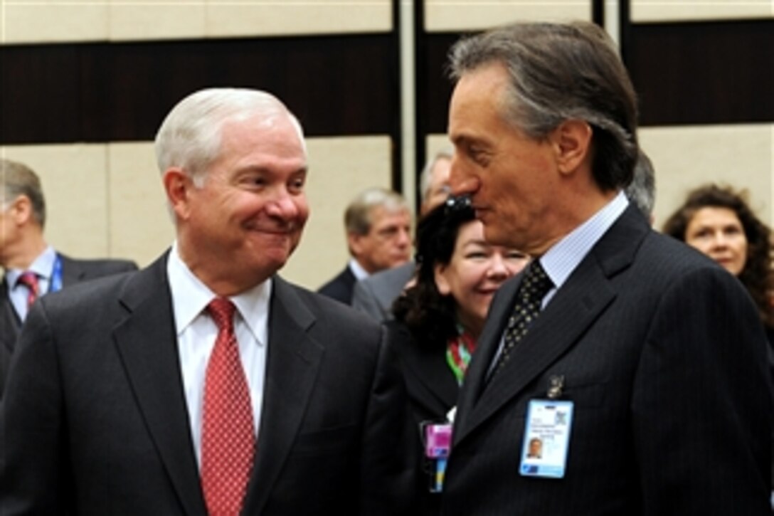 Secretary of Defense Robert M. Gates speaks with NATO Deputy Secretary General Claudio Bisogniero at the NATO headquarters in Brussels, Belgium, on March 11, 2011.  Gates is in Belgium to attend NATO Defense Ministers meetings.  
