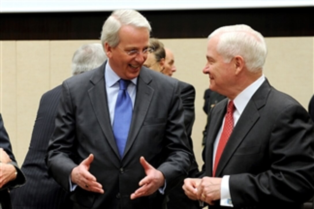 Secretary of Defense Robert M. Gates speaks with U.S. Ambassador to NATO Ivan H. Daalder at the NATO headquarters in Brussels, Belgium, on March 11, 2011.  Gates is in Belgium to attend NATO Defense Ministers meetings.  