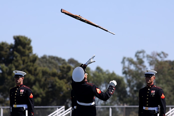 The 24-man Silent Drill Platoon displays their precise, calculated drill movements by throwing ten-pound M1 rifles from Marine-to-Marine without any verbal commands during the annual Battle Color Ceremony at Camp Pendleton’s Paige Field House, March 11. The ceremony represents the professionalism and esprit de corps that United States Marines take pride in.