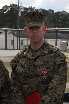 Marines from Tank Platoon, Alpha Company, Battalion Landing Team 1/1, 13th Marine Expeditionary Unit, perform daily maintenance on one of their M1-A1 Abrams Main Battle tanks while aboard the USS Green Bay, March 11, 2011. The Marines perform this maintenance to prevent salty and moist air from corroding the metal on the tanks. The ship has the capability of storing a variety of vehicles and cargo such as tanks, amphibious assault vehicles and quadcons. ::r::::n::(Official U.S. Marine Corps photo by Cpl. Christopher O’Quin)(Released)::r::::n::