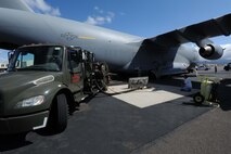Maintainers and fuel technicians fuel a C-17 in preparation for its departure on a  humanitarian mission to Japan Mar. 12 at Joint Base Pearl Harbor-Hickam, Hawaii. The plane will visit various Air Force bases in Japan during its mission to to provide support for Japan relief efforts in the wake of tsunami and earthquake damage there. (U.S. Air Force photo by Staff Sgt. Nathan Allen)