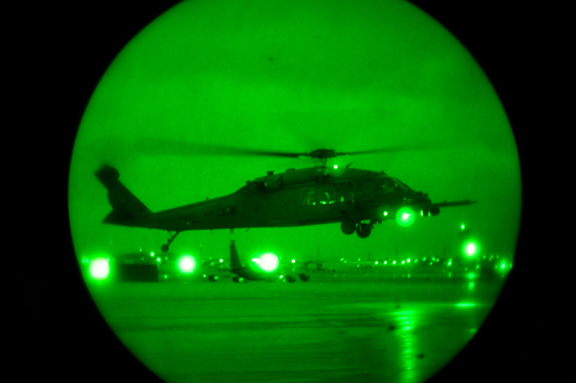 An HH-60 Pavehawk carrying members from the 33rd Rescue Squadron takeoff for mainland Japan to assist in search and rescue, here at Kadena Air Base, March 13.  Along with 33rd RQS members, 100 plus Kadena members will be providing medical attention and assistance with restoring electric power in support of disaster relief subsequent to Friday's earthquake and tsunami. (U.S. Air Force photo/Staff Sgt. Lakisha A. Croley)