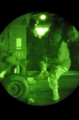 James Turnage, a maintenance flight test pilot and Staff Sgt.  Justin Spritzer, a flying crew chief, both with the 33rd Rescue Squadron standby to complete final pre-flight inspections before taking off for mainland Japan, here at Kadena Air Base, March 13. 100 plus personnel from Kadena AB will head north to provide medical and electrical power capabilities. (U.S. Air Force photo/ Staff Sgt. Lakisha A. Croley)