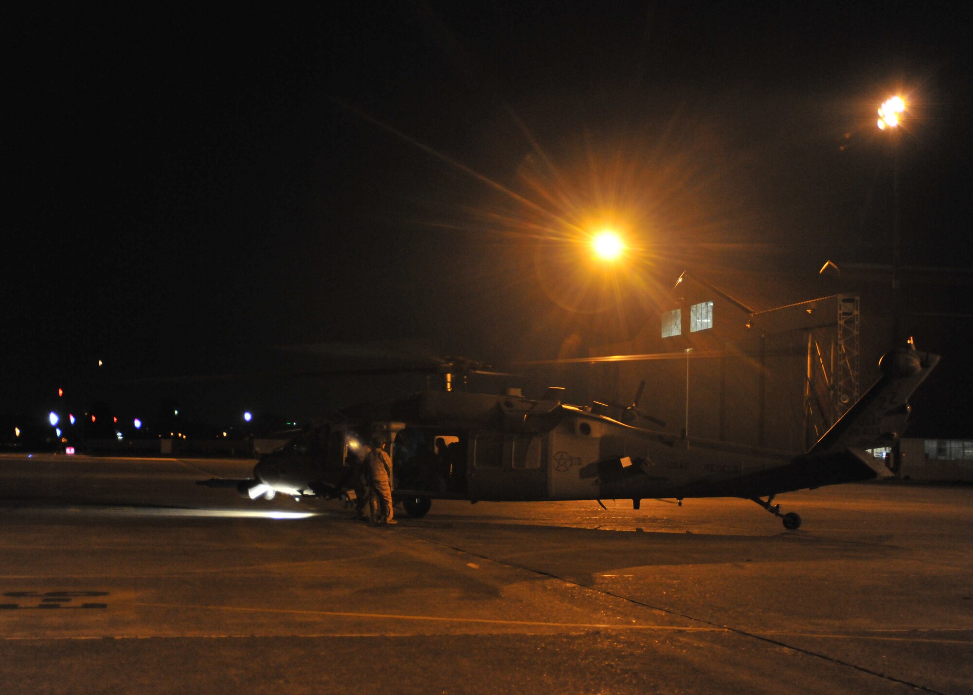 YOKOTA AIR BASE, Japan -- A HH-60G Pave Hawk helicopter arrives here March 12 as part of the first wave of American disaster relief forces and aircraft to assist with Japan's earthquake and tsunami recovery effort.  (U.S. Air Force photo/Master Sgt. Kimberly Spinner)

