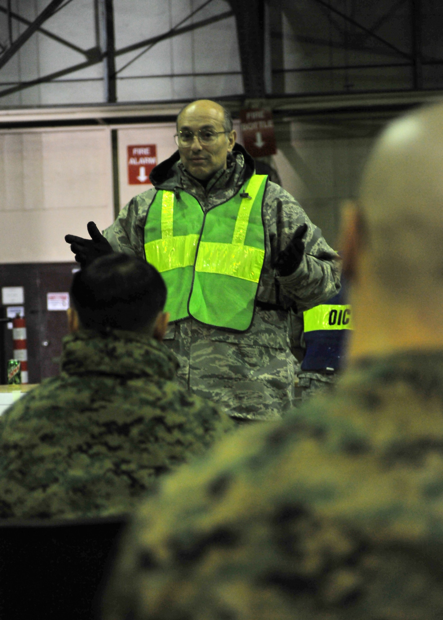 YOKOTA AIR BASE, Japan -- Lt. Col. Mark Sahady, 374th Airlift Wing chaplain, briefs the first wave of American earthquake and tsunami disaster relief forces here March 12. Yokota is receiving personnel, aircraft and supplies to support search and rescue efforts as requested by the government of Japan. (U.S. Air Force photo/Master Sgt. Kimberly Spinner)
