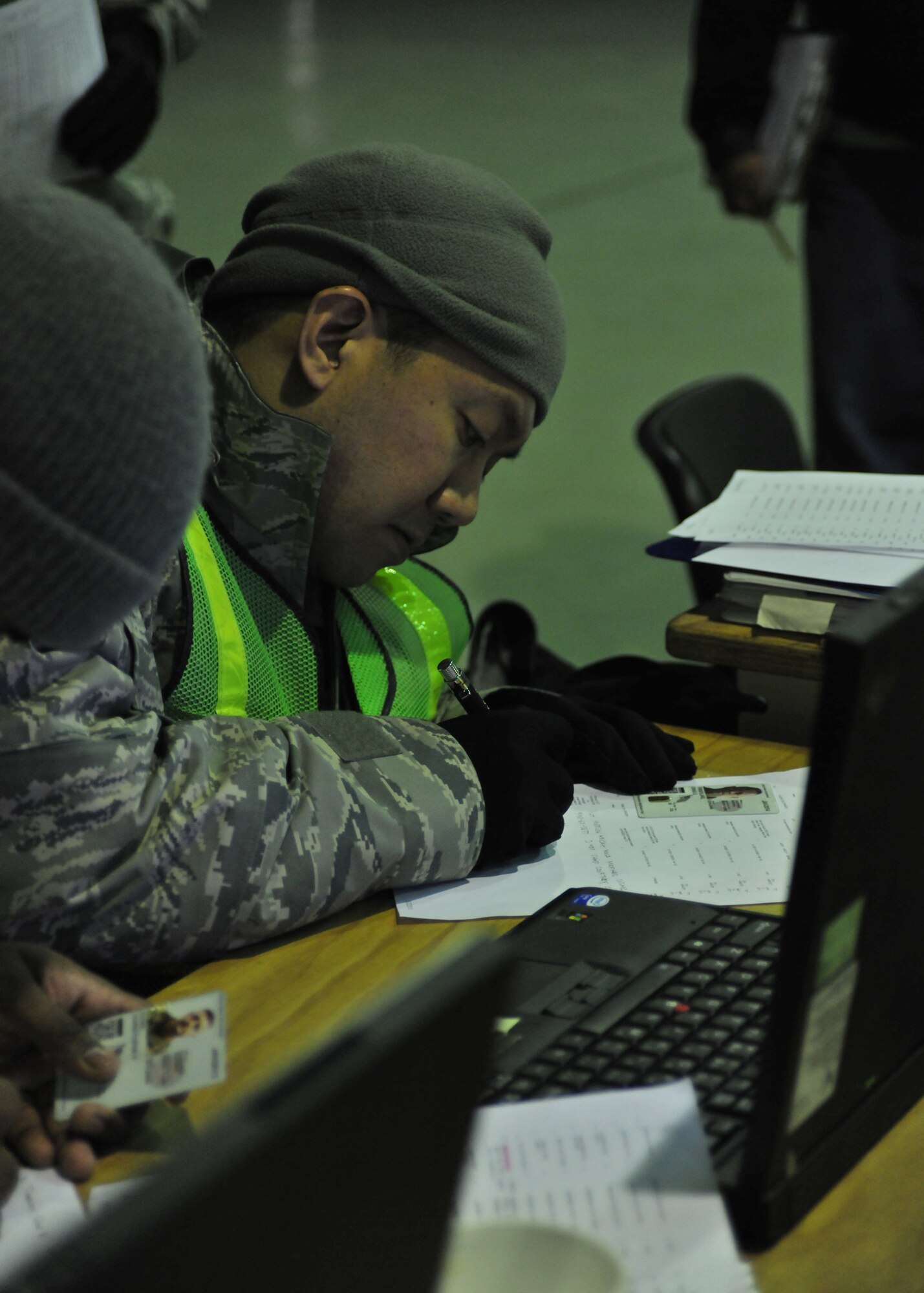 YOKOTA AIR BASE, Japan -- Tech. Sgt. Richard Ranjo, 374th Force Support Squadron, assigns lodging to the first wave of American earthquake and tsunami disaster relief forces here March 12. Yokota is receiving personnel, aircraft and supplies to support search and rescue efforts as requested by the government of Japan. (U.S. Air Force photo/Master Sgt. Kimberly Spinner)
