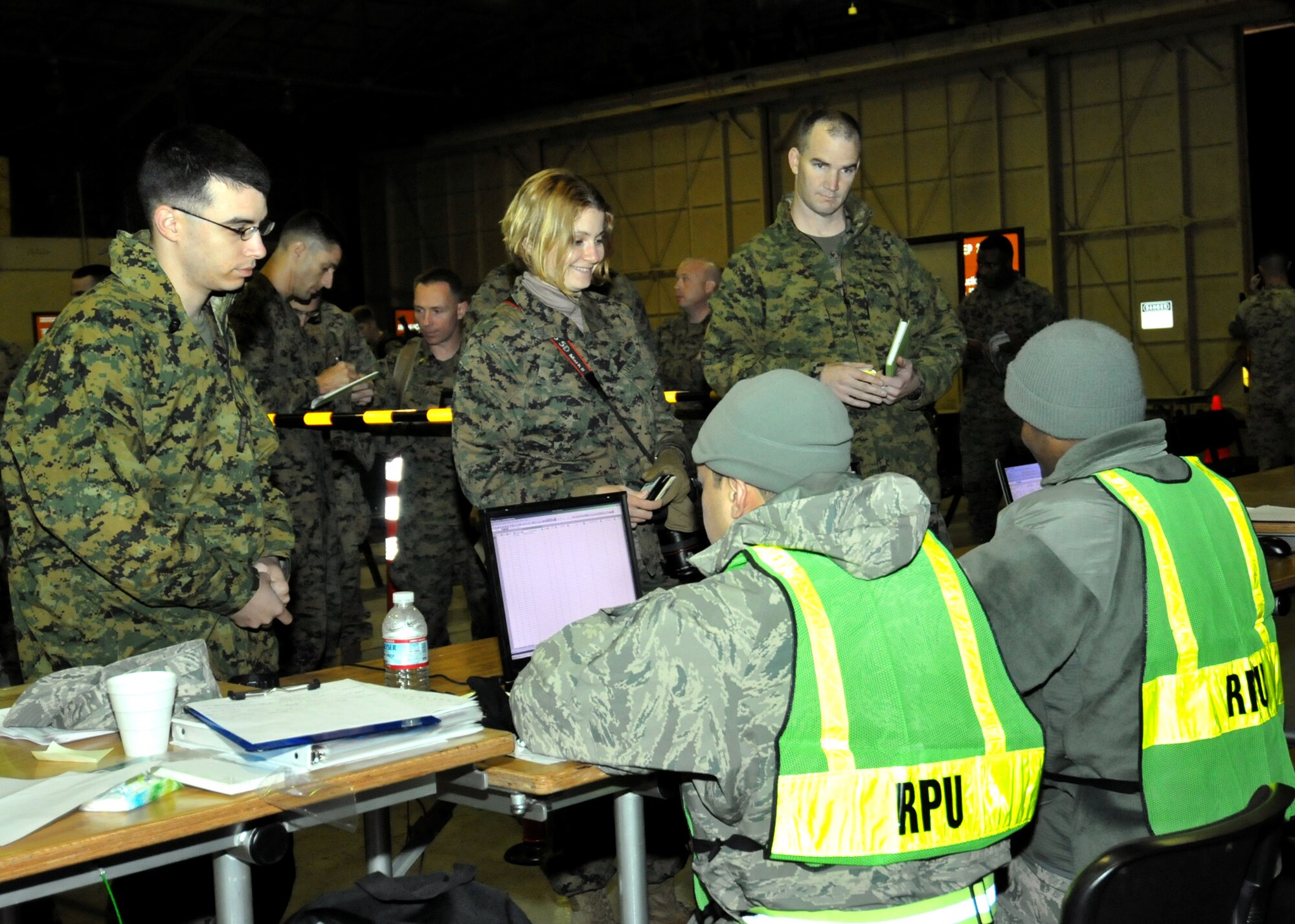 YOKOTA AIR BASE, Japan -- U.S. Marines process through the personnel receiving line here March 12. The base is in the process of receiving personnel, aircraft and vital supplies to support the earthquake and tsunami search and rescue efforts. (U.S. Air Force photo/Airman 1st Class Andrea Salazar)