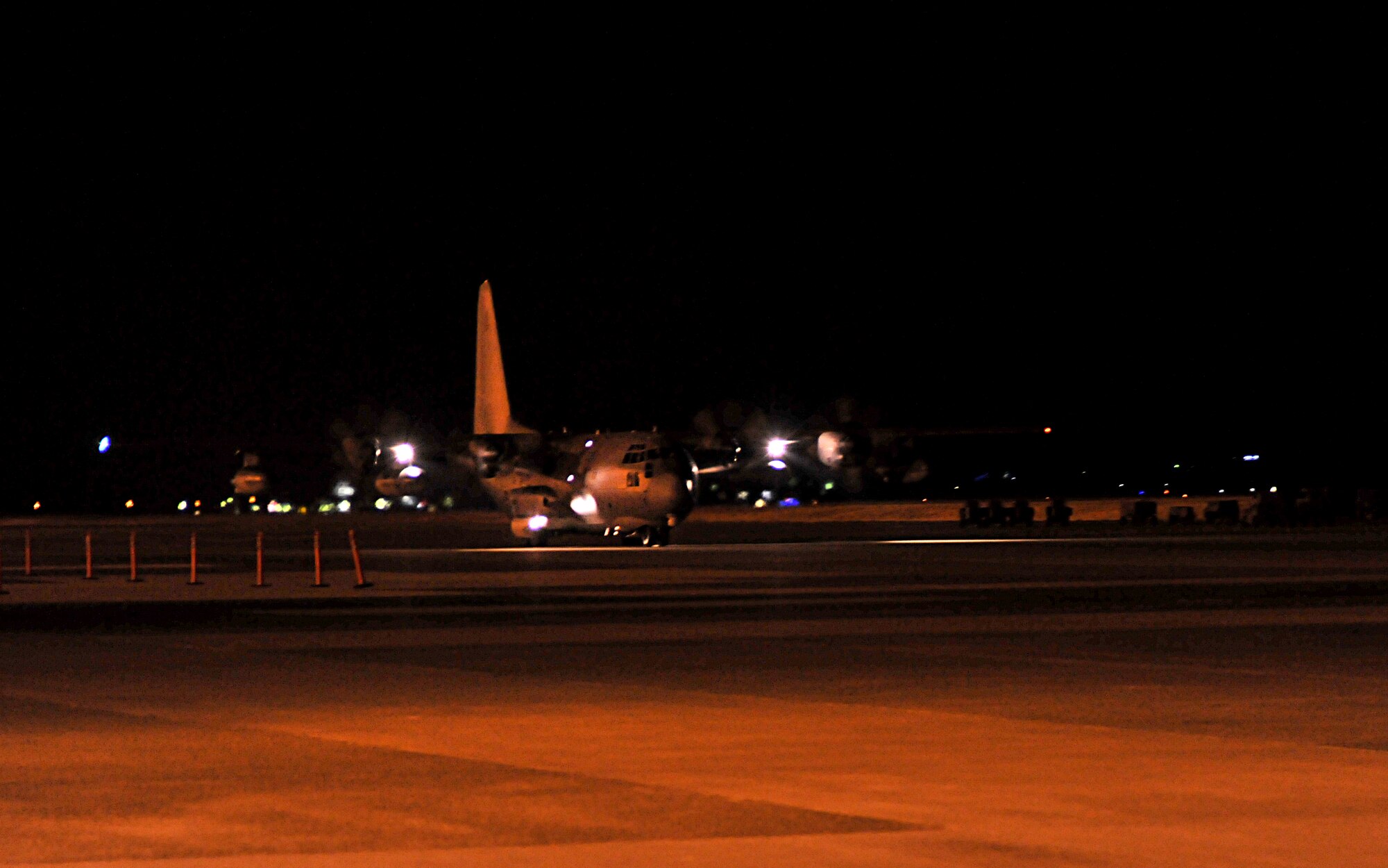 YOKOTA AIR BASE, Japan -- An MC-130P carrying U.S. Air Force personnel arrives here March 13. The flight was part of the first wave of American disaster relief forces to assist the earthquake and tsunami recovery effort. (U.S. Air Force photo/Airman 1st Class Andrea Salazar)